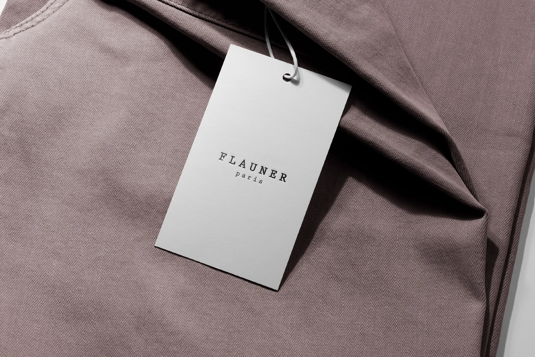 Swing Tag Mockup on Folded Tee