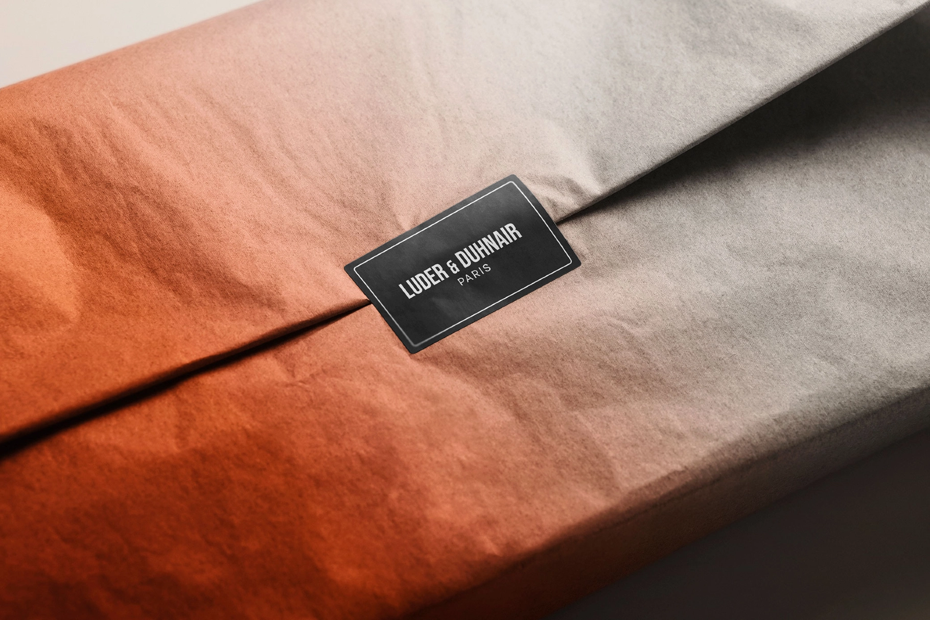 Sticker Mockup Over Folded Tissue Wrap