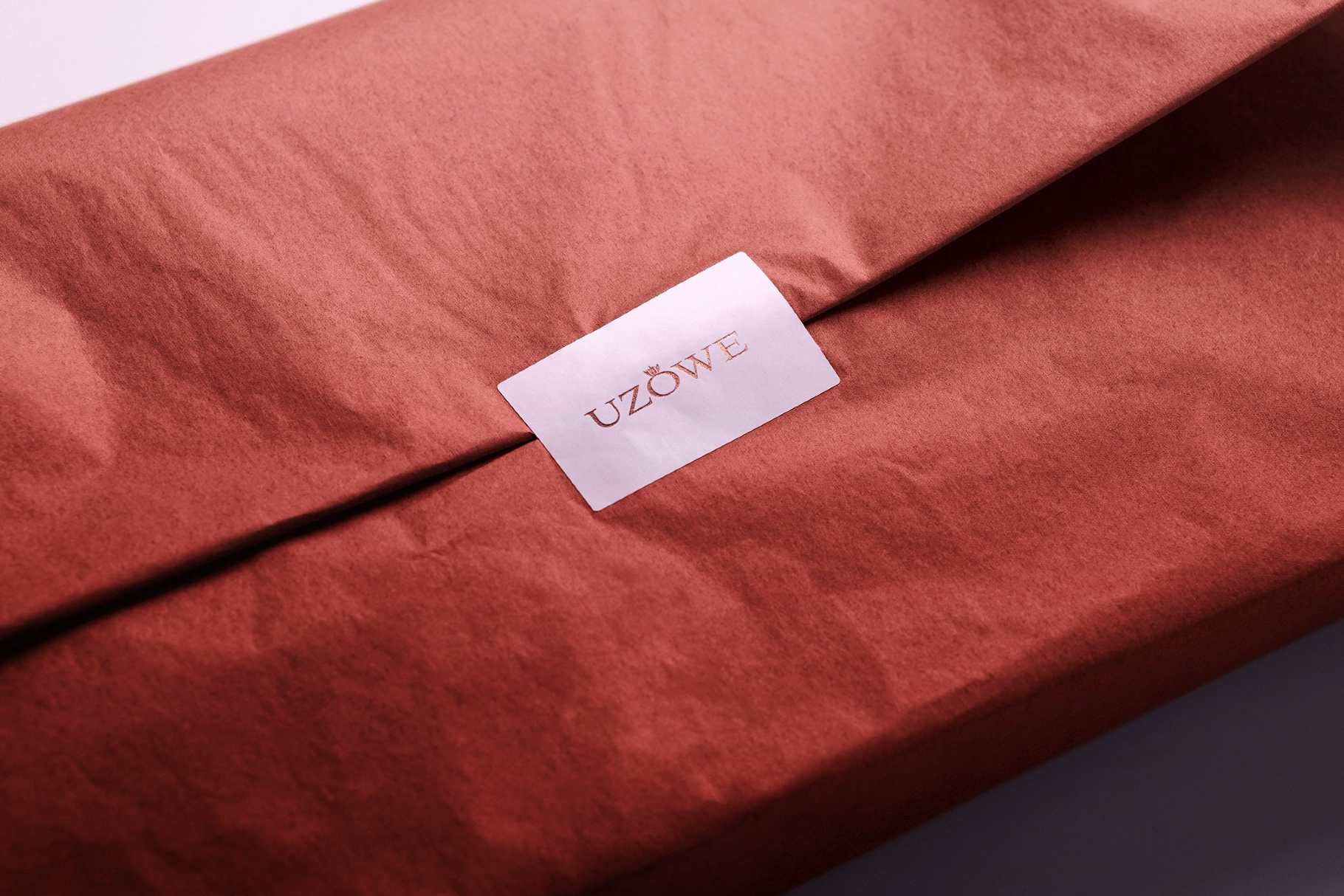 Sticker Mockup Over Folded Tissue Wrap