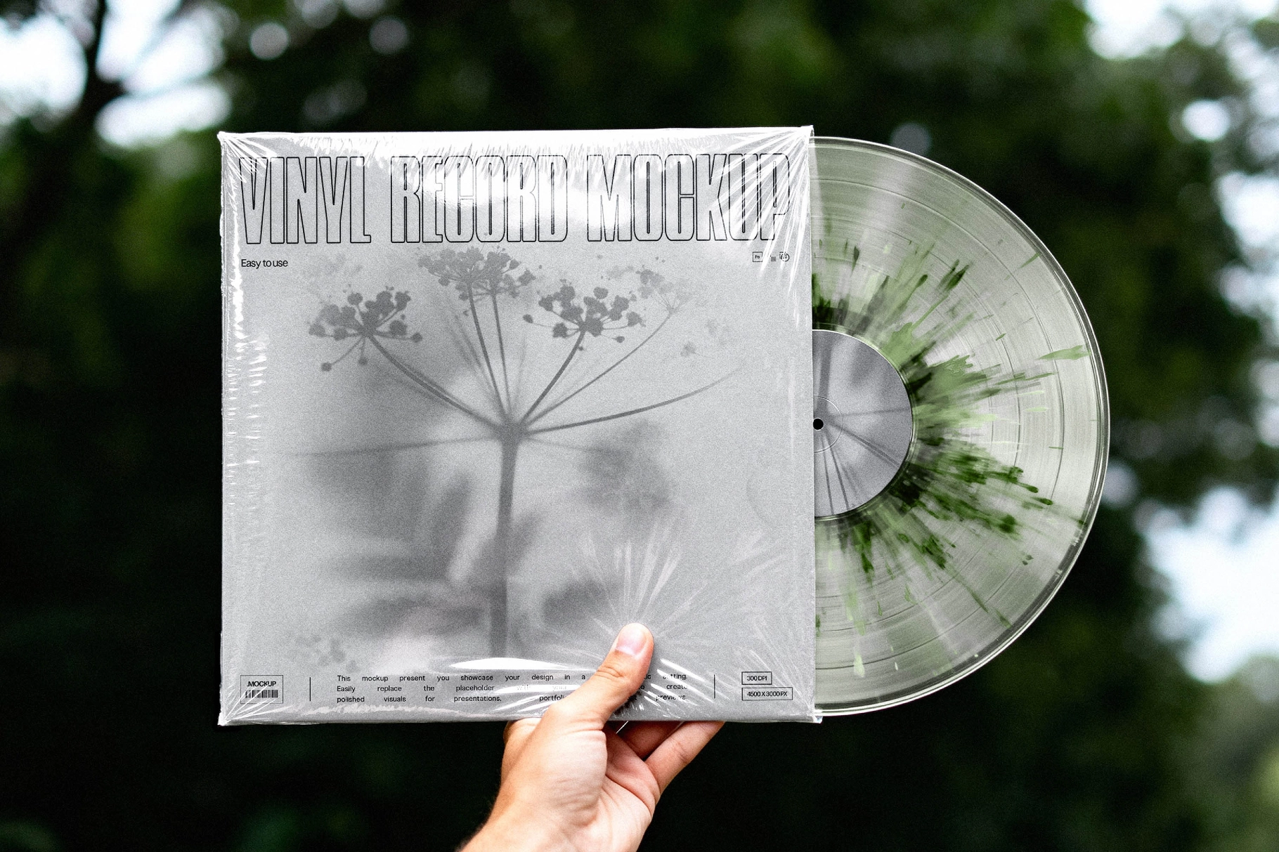 Hand Holding Vinyl Record Mockup