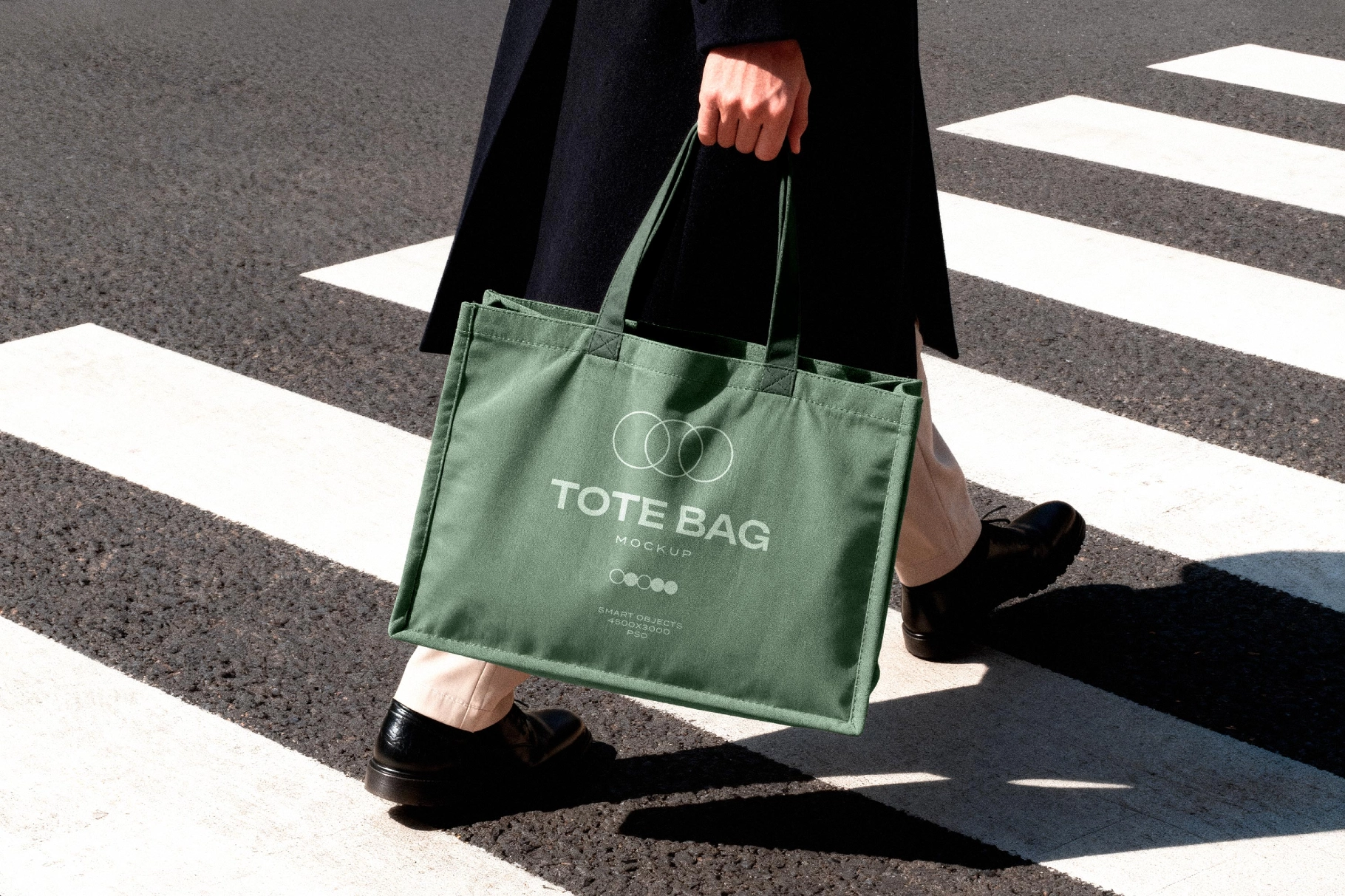 Tote Bag Mockup Held in Motion on Crosswalk