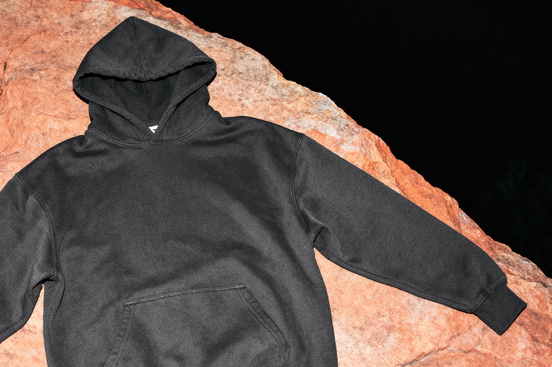 Angled Hoodie Mockup on Natural Rock