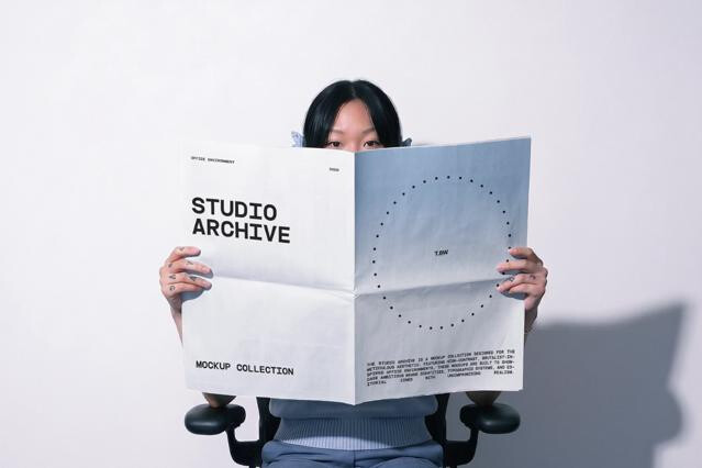 Girl Holding Paper Print Mockup