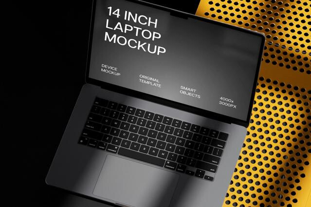Low-Angle MacBook Pro 14 on Yellow Table