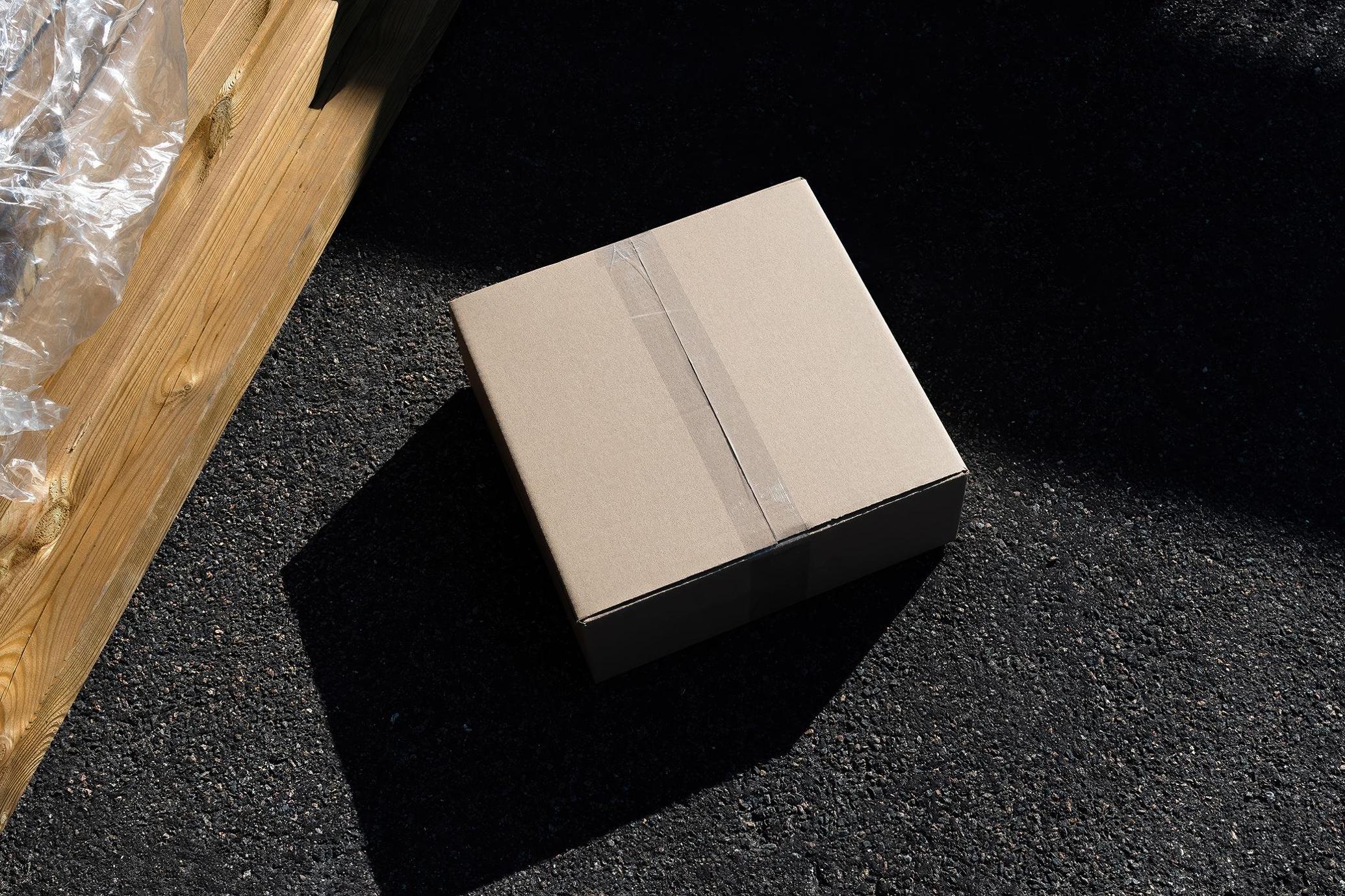 RAW Cardboard Box Mockup on Asphalt